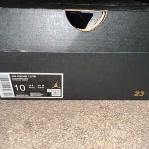 Jordan Air 1 Low Black and Gold Sneakers